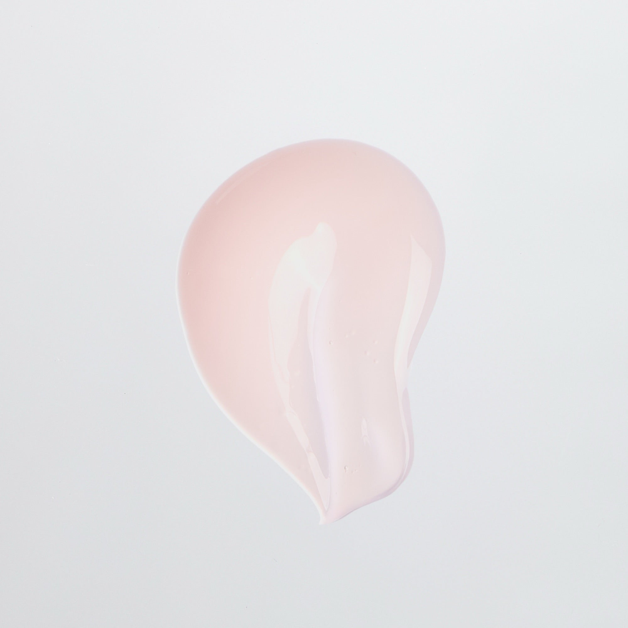 Swatch of pale pink serum